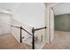 Upstairs landing featuring a carpeted floor, view of the living room, and access to the bedrooms at 2967 Albright Cmns, Kennesaw, GA 30144