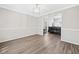 Open-concept living room featuring neutral decor and a view into other rooms at 2967 Albright Cmns, Kennesaw, GA 30144