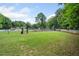 Community playground with swings and slide, adjacent to tennis courts and green space at 2967 Albright Cmns, Kennesaw, GA 30144