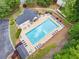 Aerial view of a neighborhood pool area with lounge chairs and manicured landscaping at 2967 Albright Cmns, Kennesaw, GA 30144
