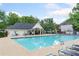 Community pool with lounge chairs, umbrellas, and clear water at 2967 Albright Cmns, Kennesaw, GA 30144