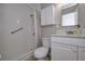 Bathroom featuring a shower over bath, vanity and wall cabinet at 3000 Kennesaw Nw Dr, Kennesaw, GA 30152