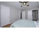 Bedroom featuring wood-look floors, ceiling fan, and ensuite bathroom at 3000 Kennesaw Nw Dr, Kennesaw, GA 30152
