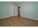 Bedroom with wood-look flooring, neutral walls and large closet at 3000 Kennesaw Nw Dr, Kennesaw, GA 30152
