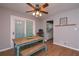 Cozy dining area with a modern light fixture, hardwood flooring, and sliding glass doors at 3000 Kennesaw Nw Dr, Kennesaw, GA 30152