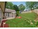 Spacious backyard featuring a stone patio, a pergola, and lush green grass leading to an upper tier at 1020 Regency Dr, Acworth, GA 30102
