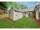 Backyard featuring a charming shed with a small patio area and a well-maintained lawn at 1020 Regency Dr, Acworth, GA 30102