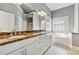 The primary bathroom features a double vanity with marble countertops, cabinets and a soaking tub at 1020 Regency Dr, Acworth, GA 30102