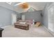 This living room features a vaulted ceiling, a ceiling fan, a skylight and access to the backyard at 1020 Regency Dr, Acworth, GA 30102