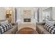 Inviting living room features a cozy fireplace, comfortable seating, and elegant decor at 1020 Regency Dr, Acworth, GA 30102