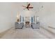 Bright living room with high ceilings, fireplace, ceiling fan, and neutral carpet at 1020 Regency Dr, Acworth, GA 30102