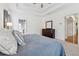 The main bedroom features carpet, a ceiling fan, tray ceiling and adjoins the en suite bathroom at 1020 Regency Dr, Acworth, GA 30102