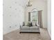 The sitting area features neutral walls, a chandelier, and a loveseat beneath a window at 1020 Regency Dr, Acworth, GA 30102