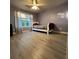 Large bedroom with hardwood floors and large windows at 1430 Lily Valley Dr, Lawrenceville, GA 30045