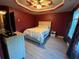 Cozy bedroom with decorative ceiling and lighting, soft carpet, and bright natural light from large windows at 1430 Lily Valley Dr, Lawrenceville, GA 30045
