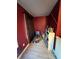 A bedroom area with curtains, a suitcase and decor on a bookshelf, ready for your personal touch at 1430 Lily Valley Dr, Lawrenceville, GA 30045