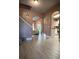 Open-concept entryway with arched doorways, light-colored laminate flooring and neutral walls at 1430 Lily Valley Dr, Lawrenceville, GA 30045