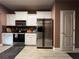 Kitchen featuring stainless steel refrigerator and access door at 1430 Lily Valley Dr, Lawrenceville, GA 30045