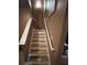 Staircase with white railings and neutral walls at 1430 Lily Valley Dr, Lawrenceville, GA 30045