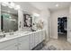 Elegant bathroom with double vanity, granite countertops, and access to walk-in closet at 172 Aspen Hall Dr, Canton, GA 30115