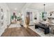 Open-concept dining area with contemporary lighting, stylish seating, and seamless flow to other living spaces at 172 Aspen Hall Dr, Canton, GA 30115