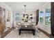 Elegant dining room featuring modern chandelier, stylish decor, and large windows for natural light at 172 Aspen Hall Dr, Canton, GA 30115