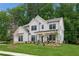 Inviting two-story home with covered porch, tasteful landscaping, and a well-kept lawn at 172 Aspen Hall Dr, Canton, GA 30115