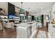 Open-concept kitchen featuring a large island with seating, stainless steel appliances, and a seamless flow to the living areas at 172 Aspen Hall Dr, Canton, GA 30115