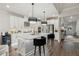 Beautiful kitchen showcasing a spacious island, stainless steel appliances, and seamless transition to the entry and living area at 172 Aspen Hall Dr, Canton, GA 30115