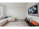 Cozy living room featuring a comfortable sectional sofa, stylish rug, and a modern television set for relaxing entertainment at 172 Aspen Hall Dr, Canton, GA 30115