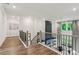 Upstairs loft area with views of the downstairs living space and backyard at 172 Aspen Hall Dr, Canton, GA 30115
