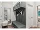 Well-organized mudroom with built-in bench, hooks, and storage cabinets at 172 Aspen Hall Dr, Canton, GA 30115