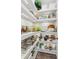 Organized pantry with ample shelving, recessed lighting, and hardwood flooring at 172 Aspen Hall Dr, Canton, GA 30115