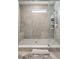 Updated shower stall with floor to ceiling tile, bench seat, and glass door at 172 Aspen Hall Dr, Canton, GA 30115
