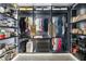 Extensive walk-in closet with custom shelves, hanging racks and an abundance of storage at 172 Aspen Hall Dr, Canton, GA 30115