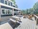 Expansive backyard deck with picnic table and outdoor seating, perfect for entertaining and relaxation at 173 Springwater Trce, Woodstock, GA 30188