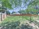 Large backyard features a wooden fence and mature trees surrounding the property at 173 Springwater Trce, Woodstock, GA 30188