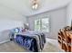 This bedroom has carpet floors, a window with natural light, and ample space at 173 Springwater Trce, Woodstock, GA 30188