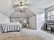 This bedroom features a slanted ceiling, a ceiling fan, and carpet floors at 173 Springwater Trce, Woodstock, GA 30188
