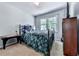 This bedroom features carpet floors, a window with natural light, and ample space at 173 Springwater Trce, Woodstock, GA 30188