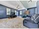 Spacious bonus room with ample natural light, ceiling fan, and comfortable seating at 173 Springwater Trce, Woodstock, GA 30188