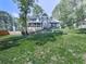 Inviting two-story home with well-maintained lawn, a deck, and an attached garage at 173 Springwater Trce, Woodstock, GA 30188