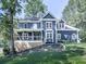 Charming two-story home with a welcoming front porch and landscaped front yard at 173 Springwater Trce, Woodstock, GA 30188