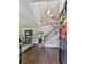 Inviting foyer with hardwood floors, a grand staircase, and high ceilings at 173 Springwater Trce, Woodstock, GA 30188