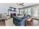 Inviting living room with a fireplace, comfortable seating, and natural light at 173 Springwater Trce, Woodstock, GA 30188