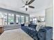Bright and airy living room with hardwood floors, large windows, and access to the outdoor space at 173 Springwater Trce, Woodstock, GA 30188