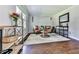 Cozy living room with hardwood floors, neutral paint, and ample seating at 173 Springwater Trce, Woodstock, GA 30188