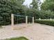 Community playground area featuring swings for on a mulched ground surface at 173 Springwater Trce, Woodstock, GA 30188