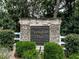 Stone sign at the entrance to 'Springfield Place' surrounded by manicured bushes at 173 Springwater Trce, Woodstock, GA 30188