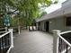 Spacious back deck perfect for outdoor dining and relaxation, surrounded by lush trees at 235 Creekside Way, Mcdonough, GA 30252